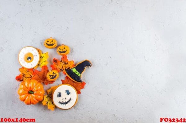 halloween background with cookies, pumpkin, leaves