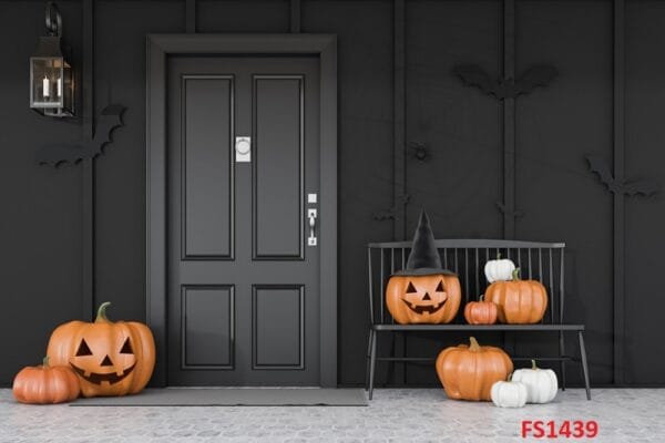 carved,pumpkins,,bats,and,spiders,near,black,front,door,of