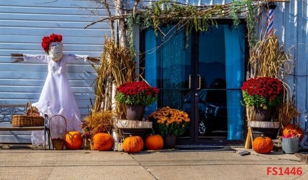 a,fall,harvest,display ,complete,with,pumpkins,,scarecrow,,autumn,flowers