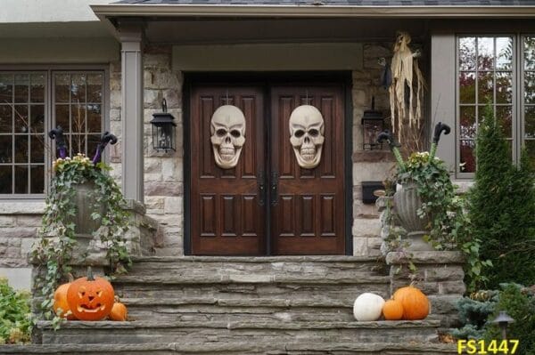 house,front,doors,with,halloween,skull,decorations,and,pumpkins