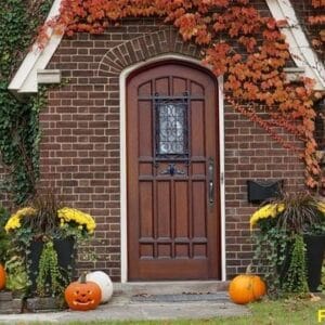 front,door,of,house,with,halloween,decorations,and,pumpkins