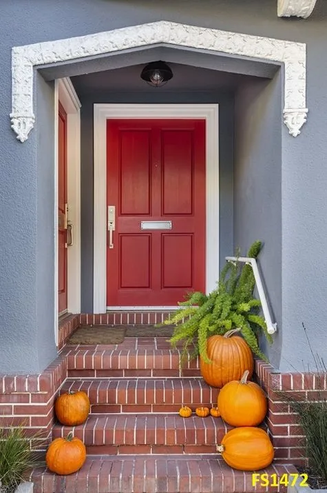 red,front,door,with,pumpkins,along,the,steps