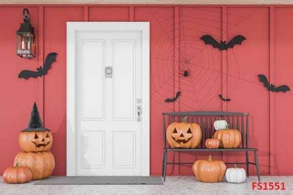 carved,pumpkins,,bats,and,spiders,near,white,front,door,of