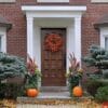 front,door,with,colorful,fall,wreath,and,pumpkins