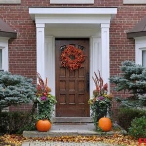 front,door,with,colorful,fall,wreath,and,pumpkins