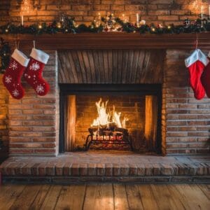 cozy living room decorated for christmas with a fireplace and beautifully wrapped gifts