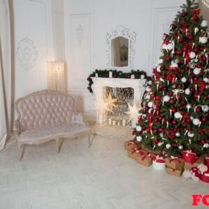 christmas living room with a fireplace, sofa, christmas tree and gifts. beautiful new year decorated classic home interior.