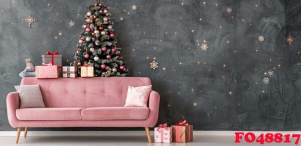 stylish pink sofa decorated for christmas with christmas tree and ornaments