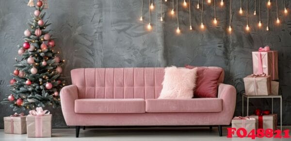 stylish pink sofa decorated for christmas with christmas tree and ornaments