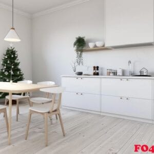 modern kitchen with white cabinets and christmas tree decorated for the holidays