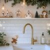 cozy kitchen decorated for the holidays with gingerbread houses and festive greenery in winter