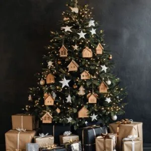 beautifully decorated christmas tree with handmade ornaments and neatly wrapped gifts underneath