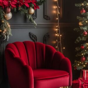 cozy red chair in a festive room decorated with a christmas tree and poinsettias