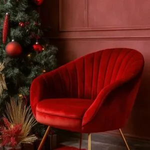 cozy red chair against a festive backdrop with christmas decorations and a tree