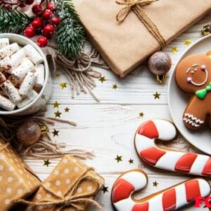 christmas background with gift box, cocoa and gingerbread cookie