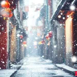 a snowy street with a red lantern hanging from the building