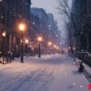 a snowy city street with a bench and street lights