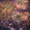 a panoramic view of fireworks with sparkling colors, creating a