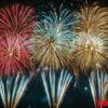 a panoramic view of fireworks with sparkling colors, creating a