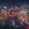 a panoramic view of fireworks with sparkling colors, creating a