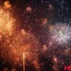 fireworks bursting in the sky above a festive celebration, with