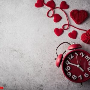 red alarm clock with red heart, valentines day concept.