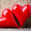 heart. red stone hearts on the wood background.