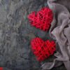 two red hearts on concrete background