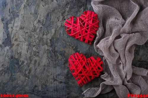two red hearts on concrete background