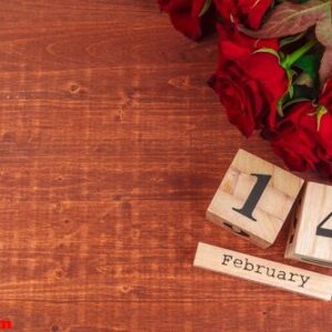 february 14 on calendar and decorations for valentine's day.