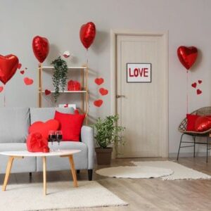 interior,of,festive,living,room,with,grey,sofa,,heart shaped,balloons