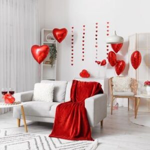 interior,of,living,room,with,sofa,,tables,and,red,balloons