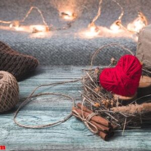 red heart in a wreath on a festive background.